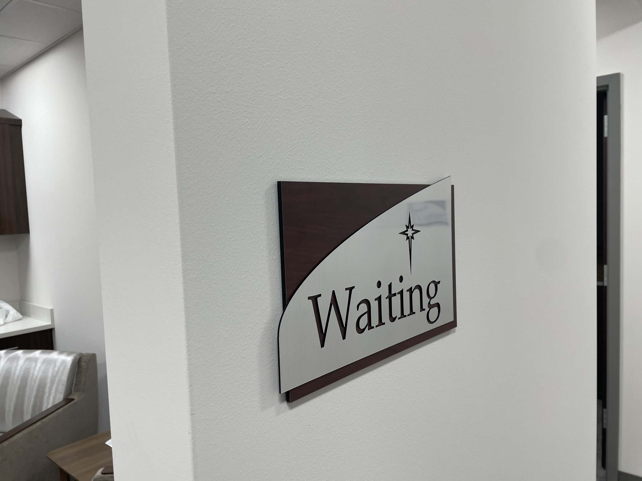 A dimensional side profile showing the layered thickness of our architectural corporate signage, featuring cut-out custom lettering and architectural curves. ADA Signage & Compliance – Allentown Lehigh Valley PA