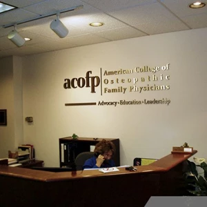 Lobby / Receptionist Sign: Brushed Gold Aluminum Sign - black painted Returns