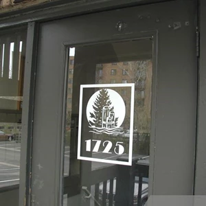 White vinyl lettering for best visibility - house number and logo on glass door