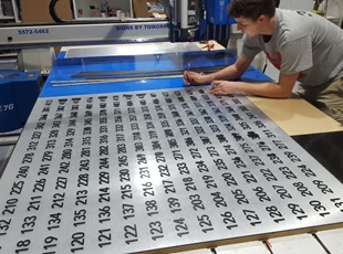 Using our AXYZ Trident to manufacture Room ID Signs