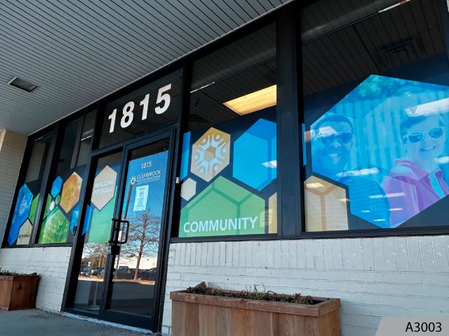 Custom designed perforated window graphics are perfect for partial privacy protection. 