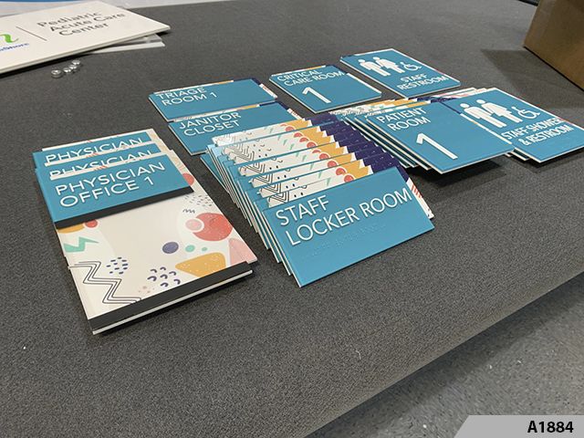 ADA Signs can be modern and creative and even matching other decorative designs and displays