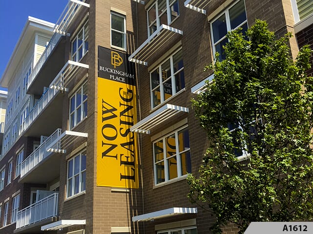 Sides of condominium and apartment buildings are prime real estate for displaying attractive leasing banner signage.