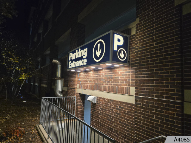 Custom designed and manufactured overhead illuminated garage sign.