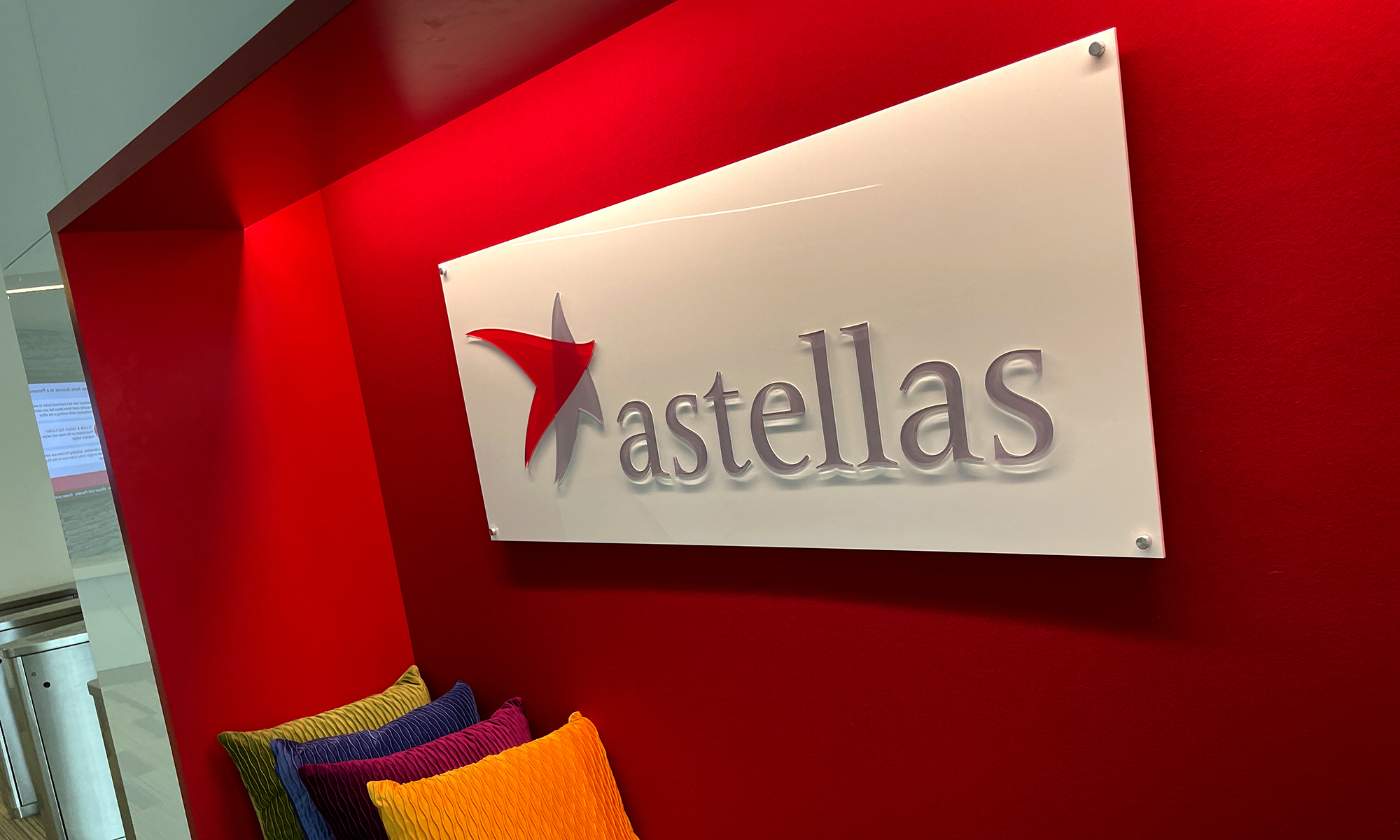 White Acrylic Sign Panel with 3D Acrylic Logo and 3D Letters installed in waiting area