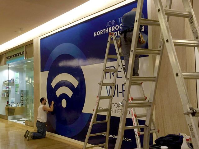 Wall Wrap or Barricade Graphics Installation