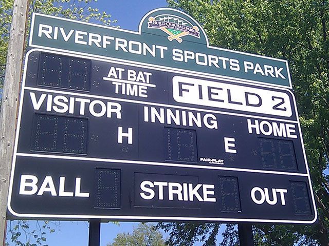 Sign Attached to Scoreboard
