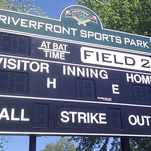 Sign Attached to Scoreboard