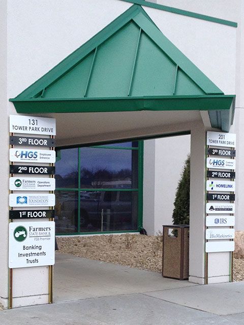 Exterior Metal Signs on Building Pillars