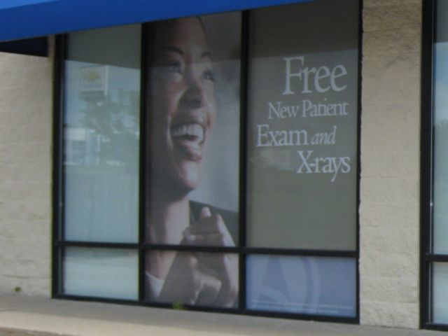Perforated Window Graphics Installed on Storefront Windows