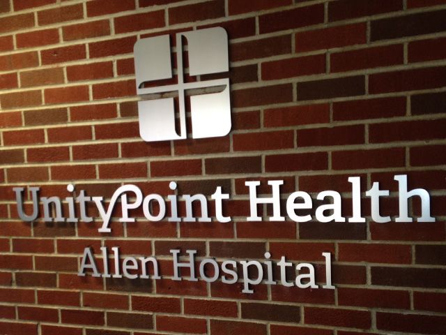 Brushed Silver Dimensional Lettering installed on Brick