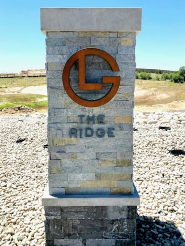 Steel & Acrylic logo stud mounted into brick Monument