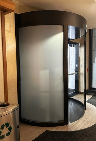 Privacy vinyl applied to revolving door