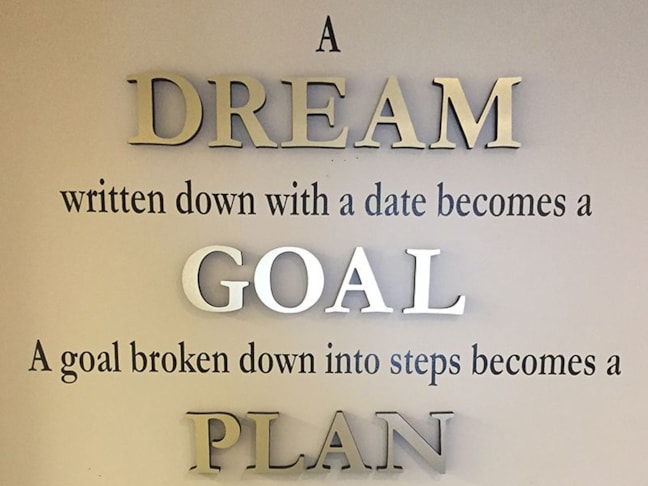 Combination of gatorfoam with brushed gold laminate and vinyl lettering