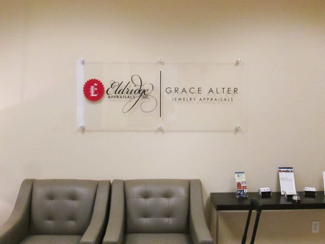 acrylic plaque w/ vinyl graphics & stand-offs