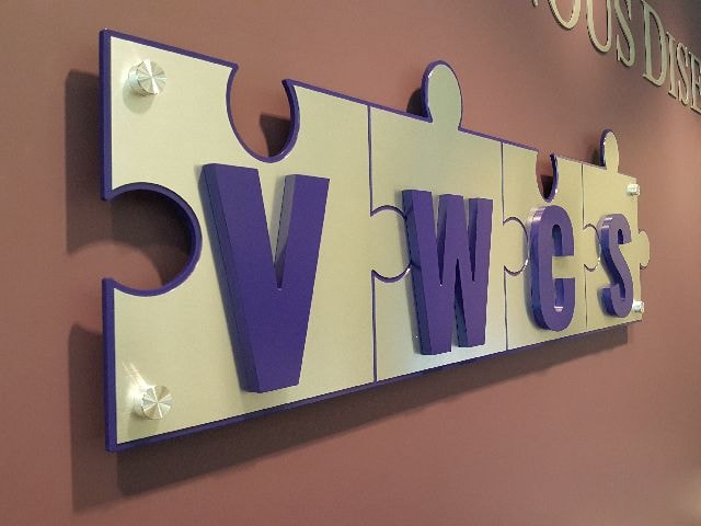 Acrylic with brushed aluminum face with painted backer & painted letters on Stand Offs